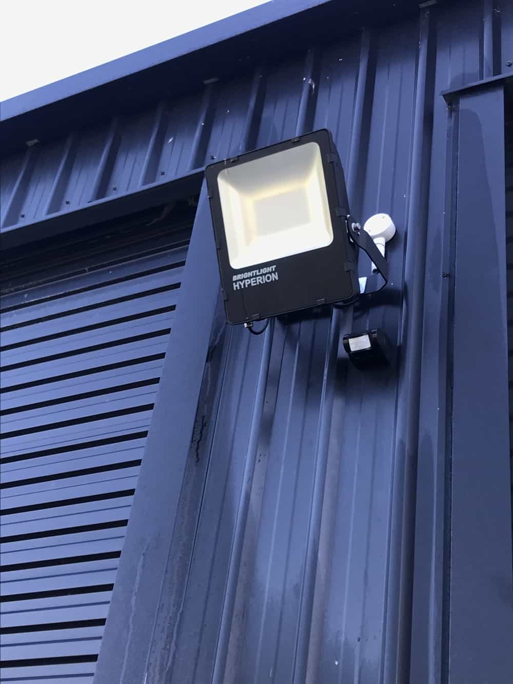 Led flood light with a dedicated sensor